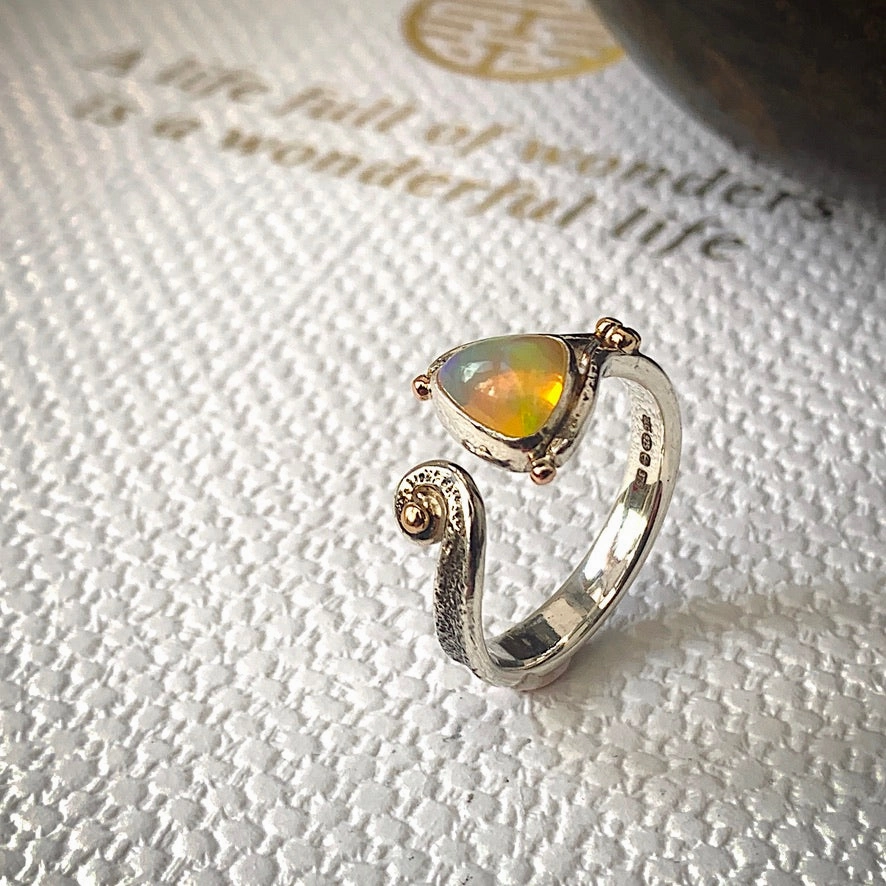 Solid sterling silver and gold ring set with incredible, ethically sourced,Ethiopian opal. Size R