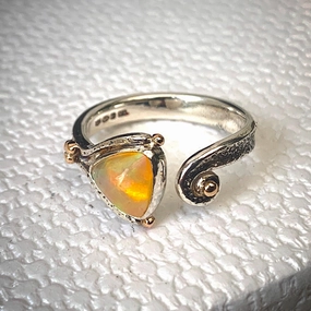 Solid sterling silver and gold ring set with incredible, ethically sourced,Ethiopian opal. Size R