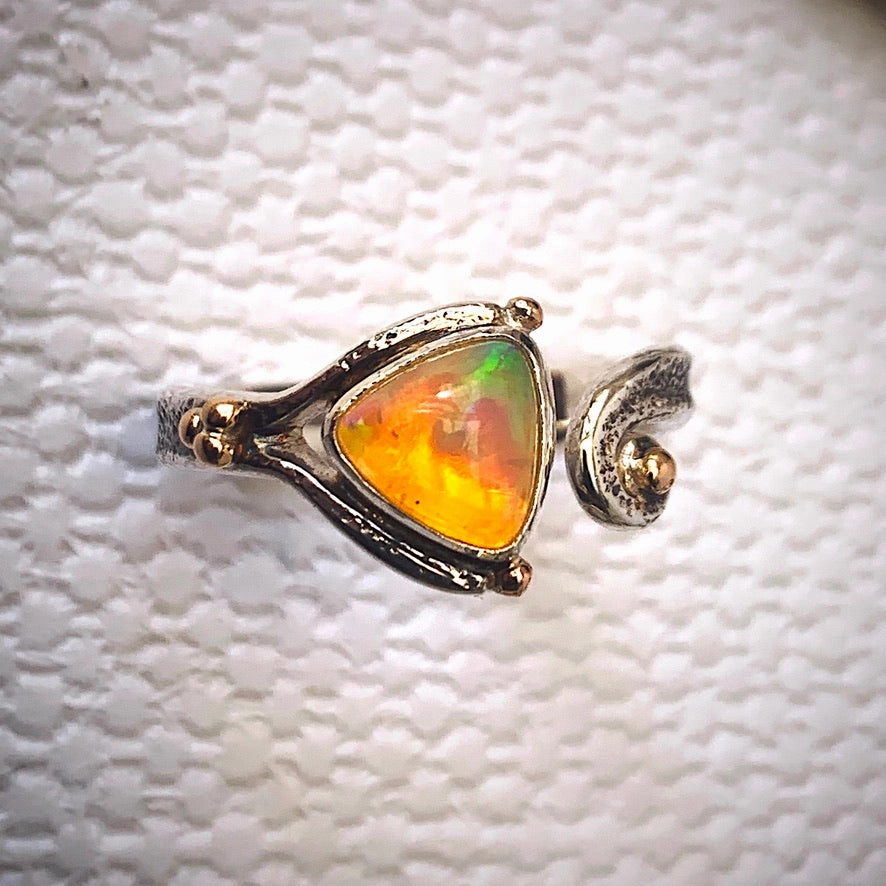Solid sterling silver and gold ring set with incredible, ethically sourced,Ethiopian opal. Size R