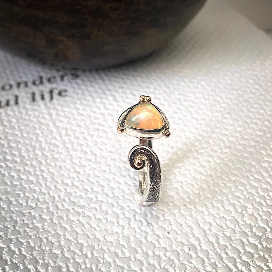 Solid sterling silver and gold ring set with incredible, ethically sourced,Ethiopian opal. Size R